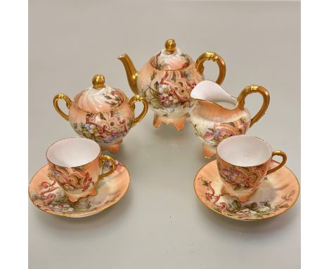 A French Limoges Edwardian morning tea service including teapot, two cups, two saucers, milk jug and sugar basin, all decorat
