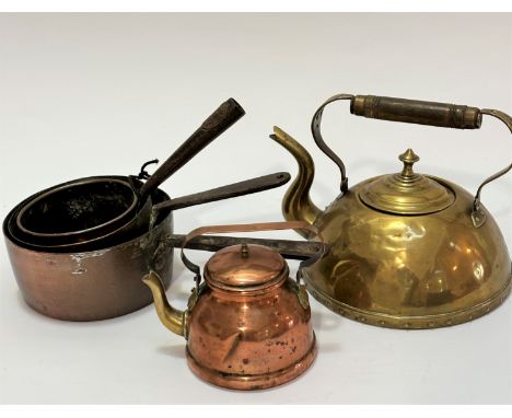 An Arts and Crafts brass beehive style teapot with treen handle, (20 x 18), a copper miniature kettle with swing handle to to