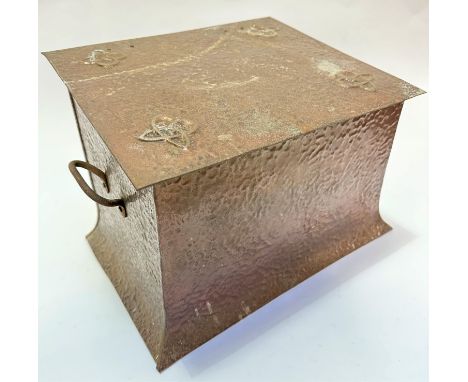 An Arts and Crafts copper finished iron slope front coal depot with stylised Celtic knot embossed design and pebbled finish w