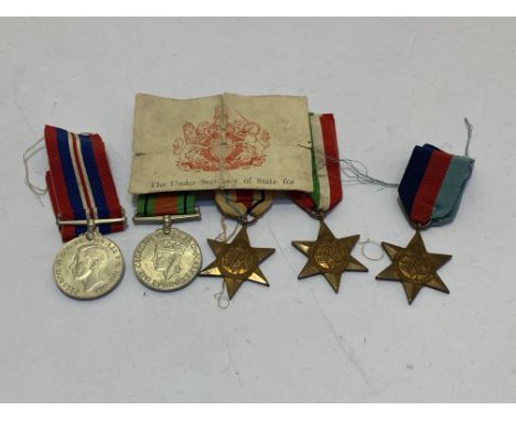 WWII medal group, 1939-45 Star, Africa, Italy, Defence and War Medal (unnamed) together with Army Council entitlement card an