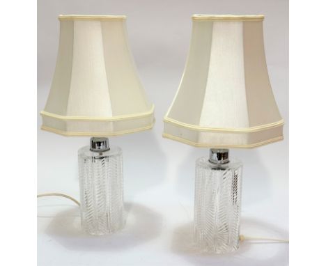 A pair of crystal slice cut cylinder table lamp bases with chrome mounts, (25 x 10, with shades h:53)