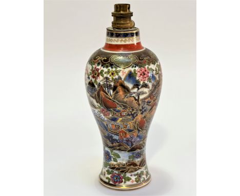 An English baluster china vase, decorated in Chinese style with chrysanthemums, figures and buildings in exotic landscape, de