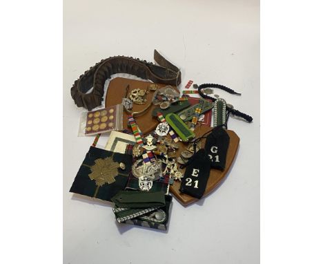 Mixed lot of cap badges, buttons, ribbon bars, German Epaulettes, cartridge belt and two wooden plaques with Scots Greys badg