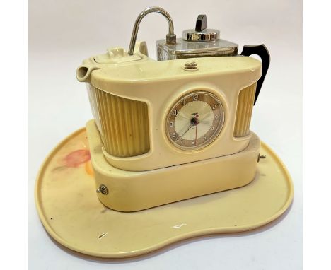 A Goblin Teasmade in white bakelite plastic complete with shaped teapot and water pot, with circular clock to front, with ver