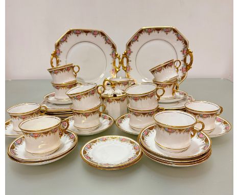 A forty three piece Royal Stafford china tea service including two cake plates, a milk jug, sugar canister complete with cove