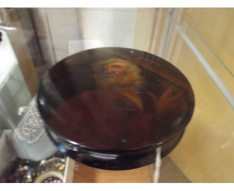 19th century Russian papier mache lacquer circular trinket box, the lid decorated with biblical male figure.  10cm diameter  