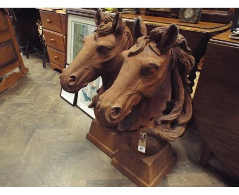 Pair of heavy rusty iron horse head garden ornaments or gate post finials standing apprx 31" high 