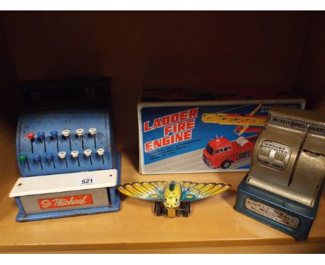 2 tin plate toy tills, fire engine and a butterfly 