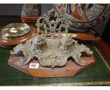 Brass desk ink stand and a modern banjo wall barometer