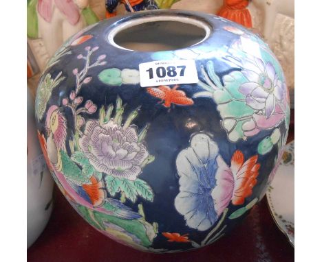 A 20th Century Chinese ginger jar with enamel decoration depicting ducks amidst flowers on a dark blue ground - no lid