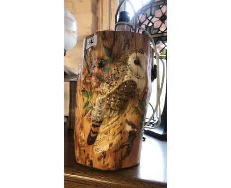 A wooden tree trunk form table lamp with hand painted barn owl and rosehip decoration - signature for Janet Mitchell