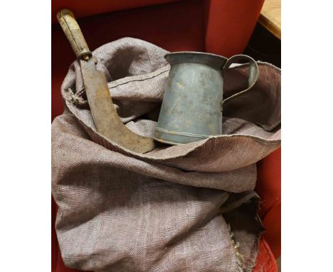 A hessian bag containing a quantity of assorted tools including billhooks, etc.