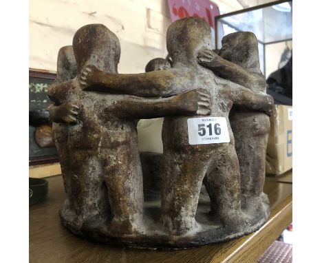 A Mexican ceramic Circle of Life figural candlestick with antiqued finish