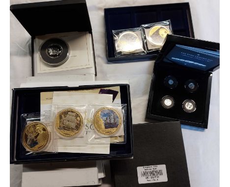 A collection of cased coin sets including Edward VIII Maundy pattern set, enamelled commemorative examples, etc.