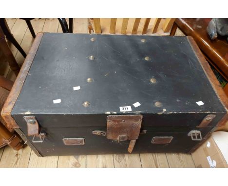 A 78cm vintage canvas clad travelling trunk with leather strapping, binding and flanking handles, the interior with original 