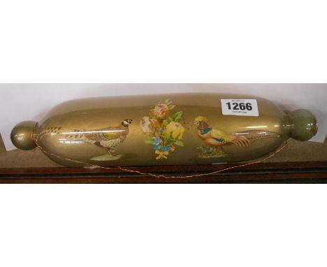 A Victorian glass rolling pin with decalcomania decoration depicting two pheasants and a floral spray on a gold ground finish