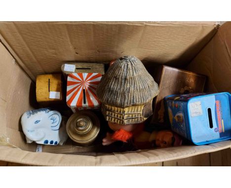 A box containing a quantity of old money boxes including LMS collecting box, Mauchline ware clock form box, etc.
