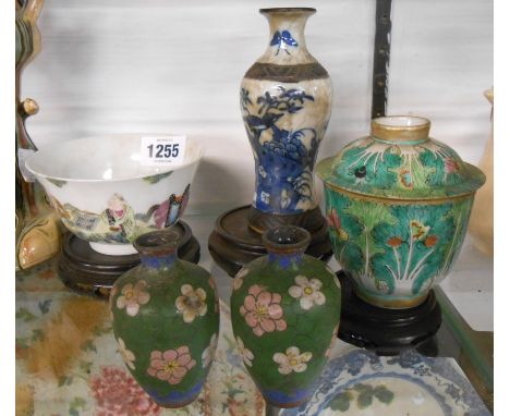 A Chinese crackle glaze vase with hand painted decoration depicting a bird amidst foliage, an antique Chinese porcelain bowl 