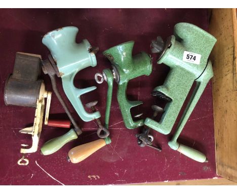 Three green enamel mincers of various makers including Spong, etc. - sold with an old grater with wooden push block