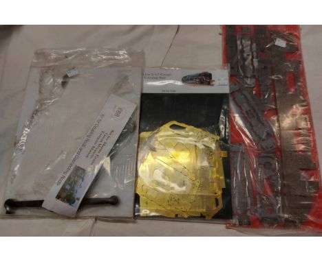 Three unopened model railway scratch building kits, each with metal parts for building trains