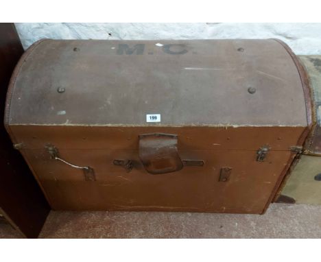 A vintage canvas dome-top travelling trunk with M.C. initials to top, lift-out internal tray and flanking leather handles