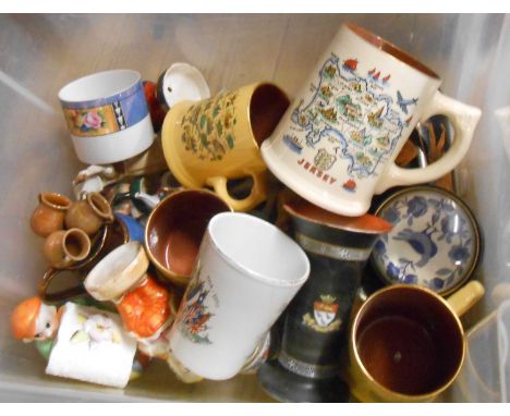 A crate containing a quantity of assorted ceramic items including Staffordshire style pepper pots, WWI Peace mug, etc.