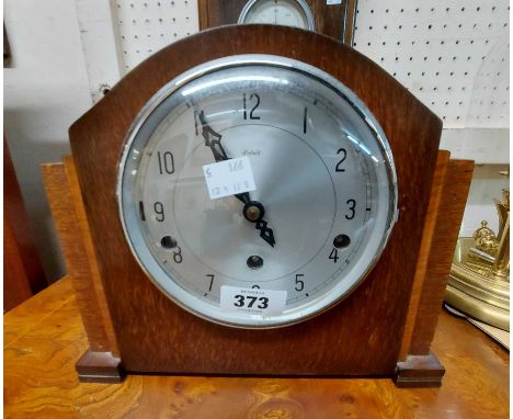 A mid 20th Century stained oak cased mantel clock with Enfield eight day chiming movement - sold with a 1930's Shortland Bros
