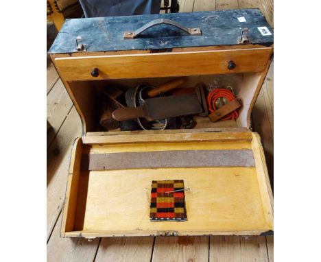 An old carpenter's tool box containing a quantity of old tools including mallet, upholstery equipment, etc.