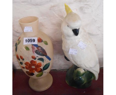 A ceramic model depicting a cockatoo seated on a branch - sold with a Victorian opaque glass vase with enamel decoration depi