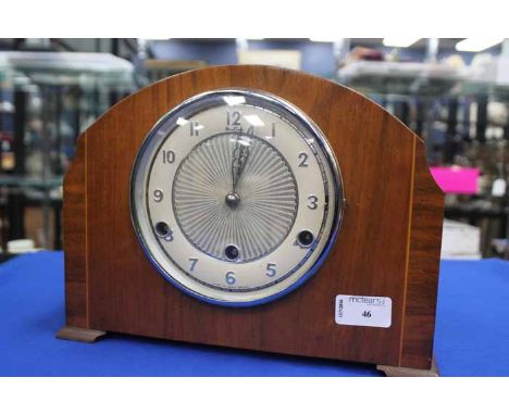 MAHOGANY LINE INLAID MANTEL CLOCK
with silvered dial and in the Art Deco style, two train movement, with key 