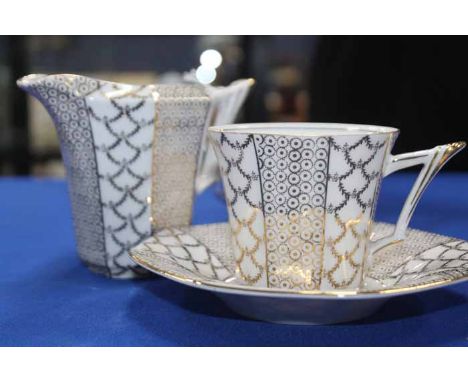 BONE CHINA TEA SERVICEcomprising ten teacups, twelve saucers and side plates; together with two part tea service decorated in