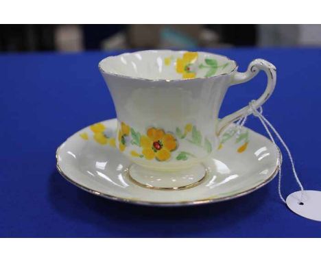 ROYAL PARAGON ATTRACTIVE PART TEA SERVICE
decorated with yellow flowers on a pale lemon ground with gilt highlights; together