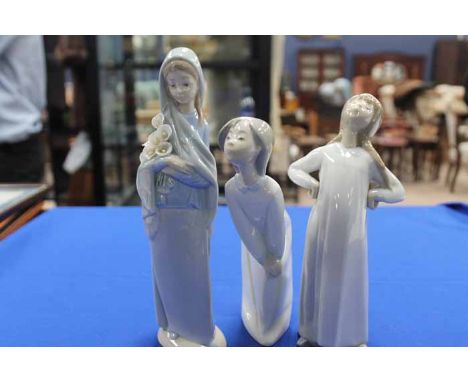 THREE LLADRO FIGURES
a Nao figure and a Spanish figure 