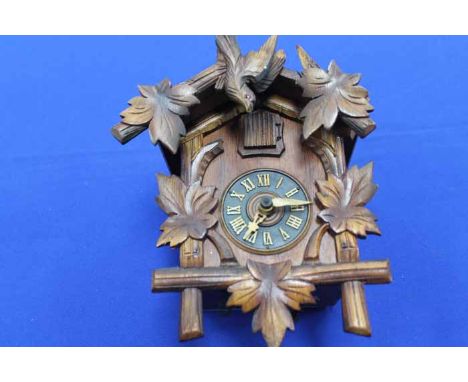  GERMAN CUCKOO CLOCK
and a wooden musical nativity scene 