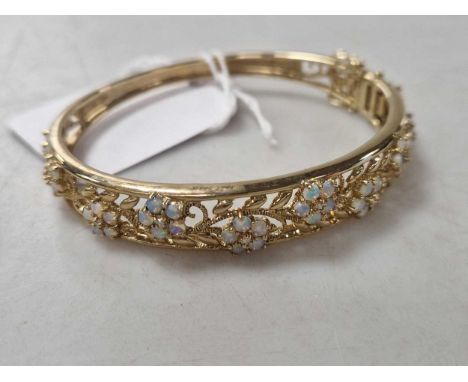 An opal and diamond bangle, hallmarked Birmingham, 9ct gold, weight 21g