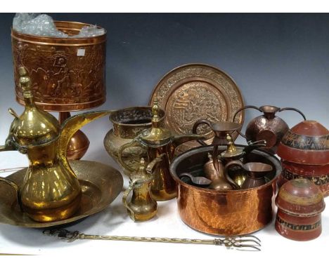 A quantity of Eastern brass and copper metal wares to include water jugs, bowls, a Gambian copper lamp shade etc (qty)