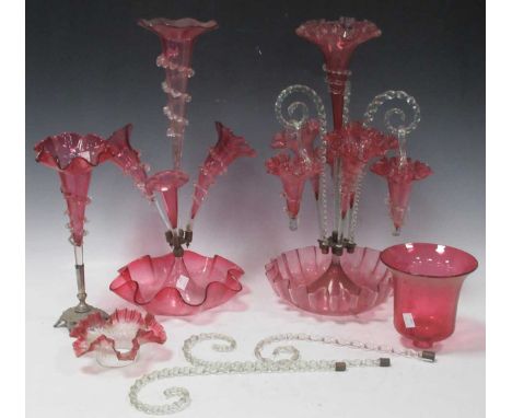 A Victorian four branch epergne with three hanging baskets on a scalloped base. Together with a three branch epergne (AF) and