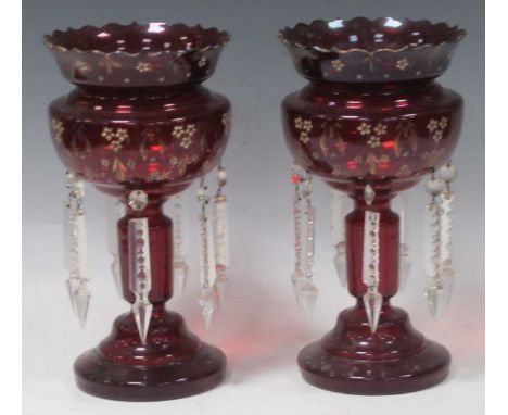 A pair of ruby glass lustres, 28cm high