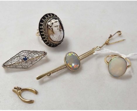 an opal ring tested as 18ct gold weight 2.7g, together with an opal brooch tested as 9ct gold, a brooch tested as 9ct gold an