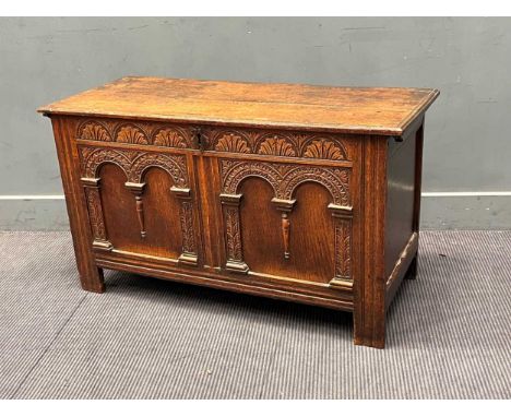 A late 18th century oak coffer with architectural panel front. 60cm x 107cm x 46cm