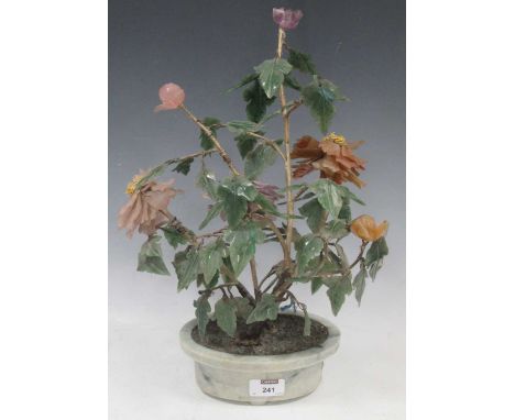 A Chinese hardstone model shrub or tree with colourful leaves, in an oval plant-holder shape baseplease see further images fo