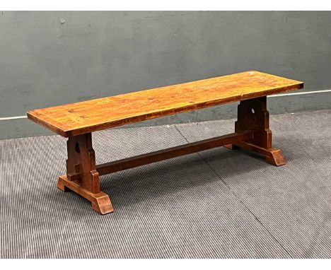 A 20th century oak bench with deep seat with pierced trefoil end supports. 46cm x 152cm x 45cm (one foot loose) together with