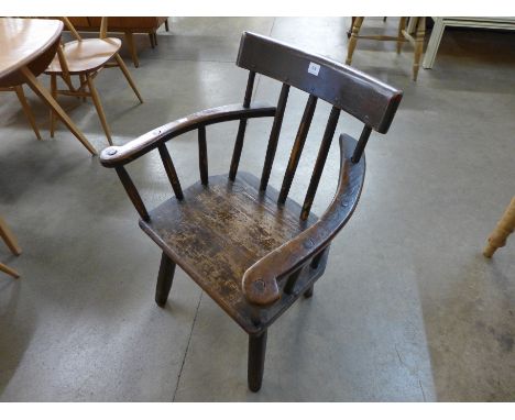 A late 18th Century primitive elm stick back chair
