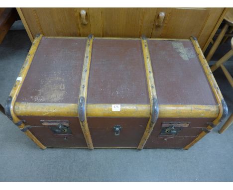 A banded travel trunk