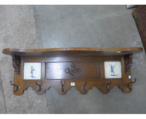 An oak wall hanging coat rack