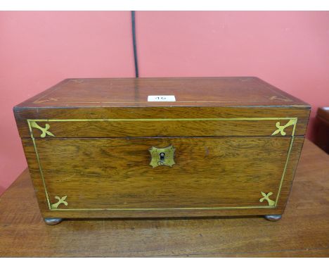 A George IV rosewood and brass inlaid tea caddy
