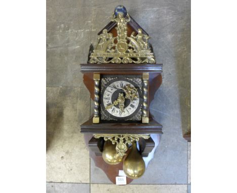 A Dutch mahogany and brass wall clock