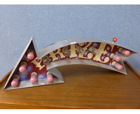 An illuminated fairground arrow Prize sign