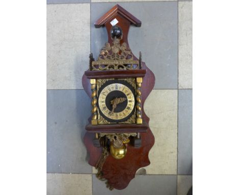 A Dutch mahogany and brass wall clock