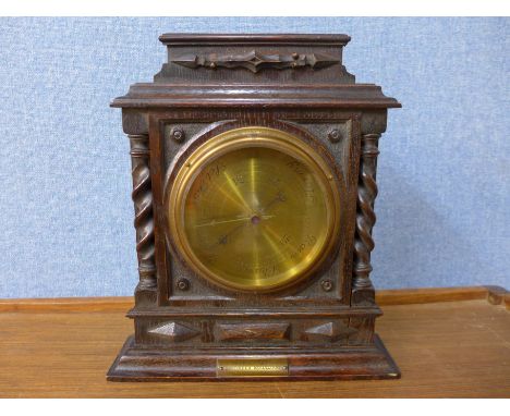 A 1920's oak aneroid barometer